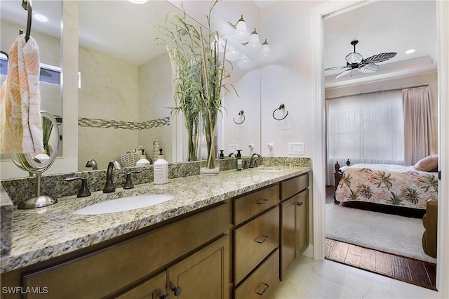 14274 Arrow Point Ct, Estero, FL 33928 - bathroom featuring double vanity, connected bathroom, and a ceiling fan