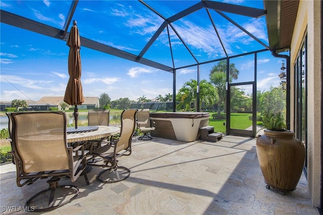 14274 Arrow Point Ct, Estero, FL 33928 - view of patio / terrace featuring glass enclosure, a hot tub, and outdoor dining area