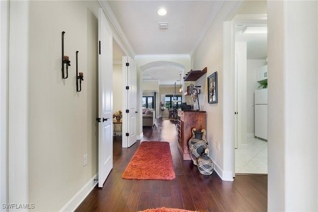 14274 Arrow Point Ct, Estero, FL 33928 - hallway with wood finished floors, arched walkways, and crown molding