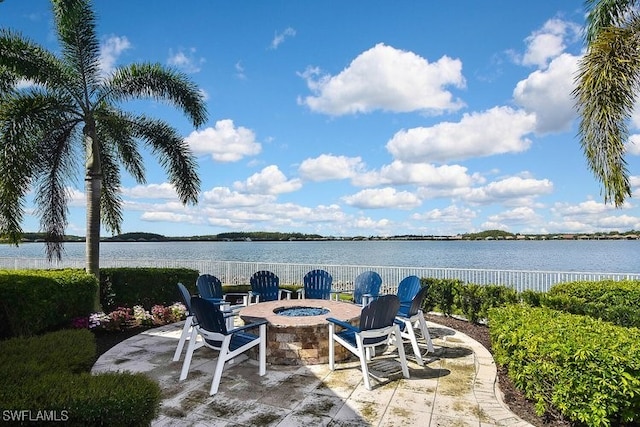14274 Arrow Point Ct, Estero, FL 33928 - view of patio / terrace with a fire pit and a water view