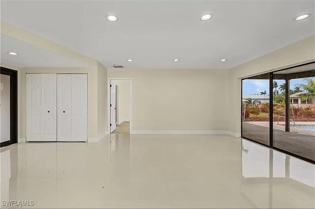 813 SW 52nd St, Cape Coral, FL 33914 - spare room featuring tile patterned floors and recessed lighting