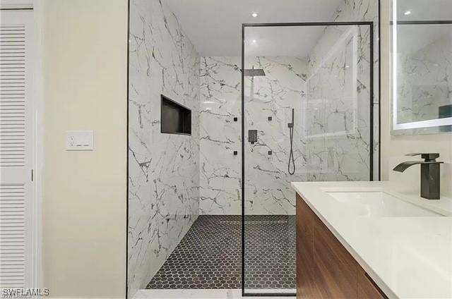 813 SW 52nd St, Cape Coral, FL 33914 - full bathroom featuring a marble finish shower, vanity, and recessed lighting