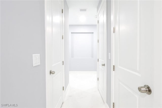 2714 2nd St SW, Lehigh Acres, FL 33976 - hallway with light marble finish floors and recessed lighting