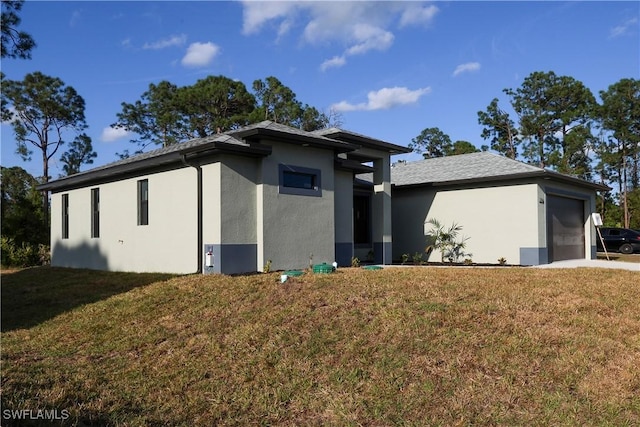 2714 2nd St SW, Lehigh Acres, FL 33976 - view of front facade with stucco siding, a front lawn, and a garage
