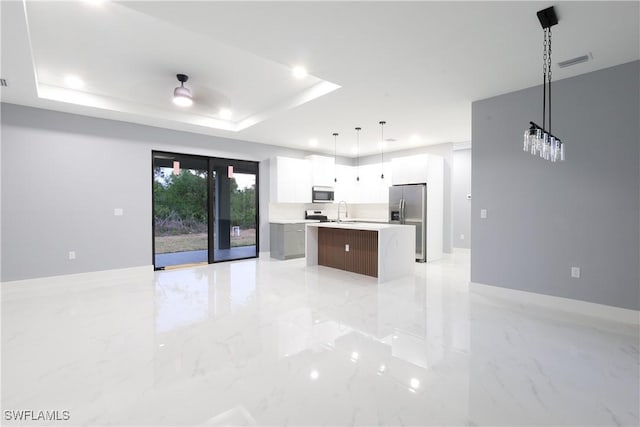 2714 2nd St SW, Lehigh Acres, FL 33976 - kitchen with stainless steel appliances, light marble finish floors, light countertops, open floor plan, and recessed lighting