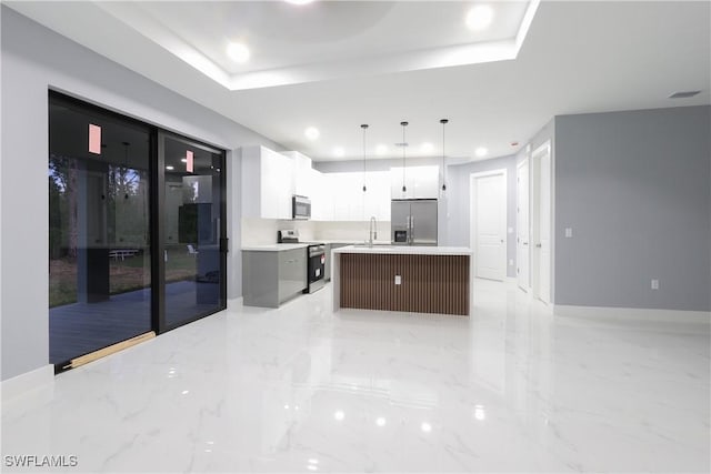 2714 2nd St SW, Lehigh Acres, FL 33976 - kitchen featuring appliances with stainless steel finishes, recessed lighting, light countertops, light marble finish floors, and decorative light fixtures