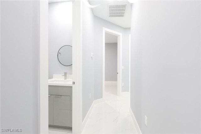 2714 2nd St SW, Lehigh Acres, FL 33976 - corridor with light marble finish floors and baseboards