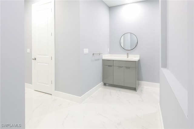 2714 2nd St SW, Lehigh Acres, FL 33976 - bathroom featuring marble finish flooring and vanity