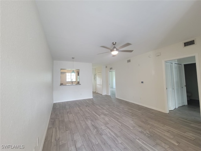 8313 Bernwood Cove Loop Unit 1211, Fort Myers, FL 33966 - unfurnished living room featuring ceiling fan and wood finished floors