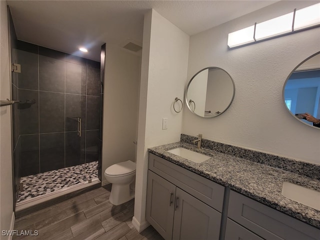 8313 Bernwood Cove Loop Unit 1211, Fort Myers, FL 33966 - full bath featuring double vanity, a shower stall, wood finish floors, and recessed lighting