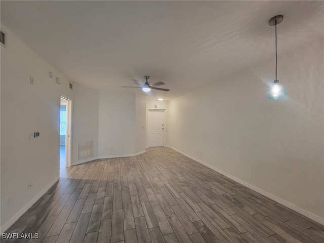8313 Bernwood Cove Loop Unit 1211, Fort Myers, FL 33966 - empty room with wood finished floors and ceiling fan