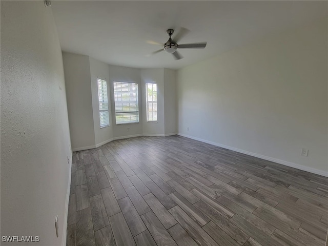 8313 Bernwood Cove Loop Unit 1211, Fort Myers, FL 33966 - spare room featuring dark wood finished floors and ceiling fan