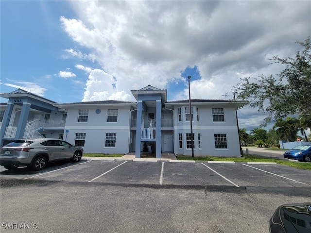8313 Bernwood Cove Loop Unit 1211, Fort Myers, FL 33966 - view of building exterior with uncovered parking