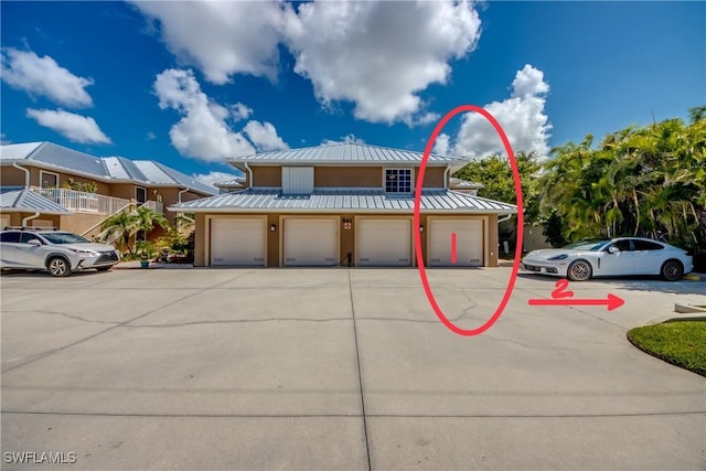 841 SW 47th Ter Unit 206, Cape Coral, FL 33914 - view of property with a standing seam roof and a metal roof