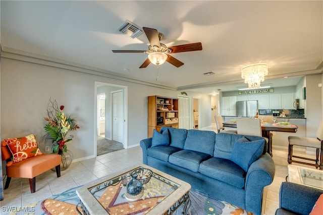 841 SW 47th Ter Unit 206, Cape Coral, FL 33914 - living area featuring light tile patterned floors, a ceiling fan, and a chandelier