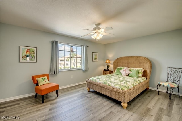 841 SW 47th Ter Unit 206, Cape Coral, FL 33914 - bedroom featuring wood finished floors and ceiling fan