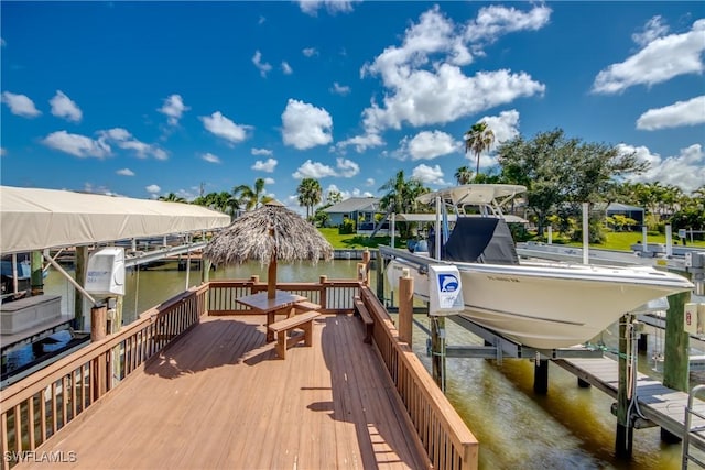 841 SW 47th Ter Unit 206, Cape Coral, FL 33914 - dock area featuring boat lift and a water view