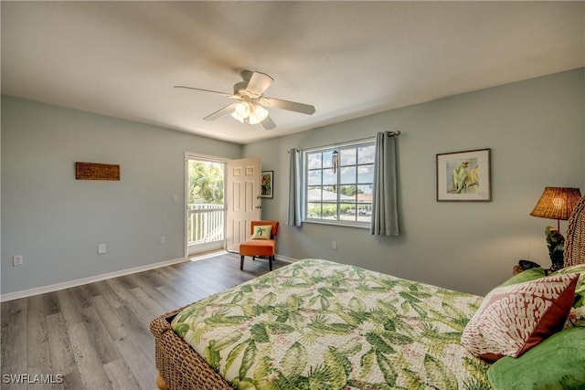 841 SW 47th Ter Unit 206, Cape Coral, FL 33914 - bedroom featuring access to outside, wood finished floors, and ceiling fan