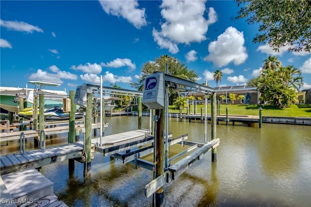 841 SW 47th Ter Unit 206, Cape Coral, FL 33914 - dock area featuring boat lift and a water view