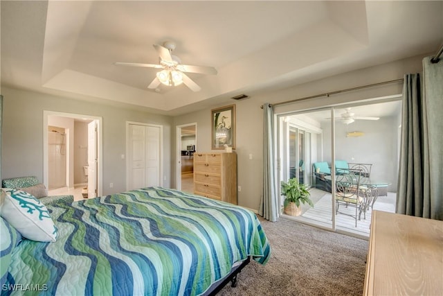 841 SW 47th Ter Unit 206, Cape Coral, FL 33914 - bedroom with a raised ceiling, access to exterior, carpet floors, ceiling fan, and connected bathroom