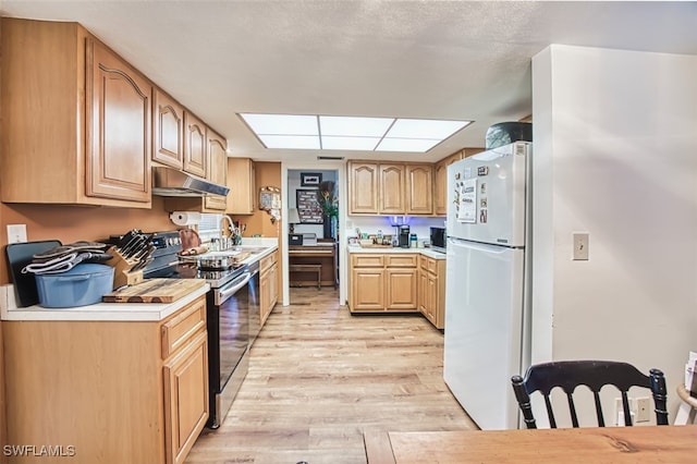 5554 Hamlet Ln, Fort Myers, FL 33919 - kitchen with freestanding refrigerator, stainless steel electric range, under cabinet range hood, light wood finished floors, and light countertops