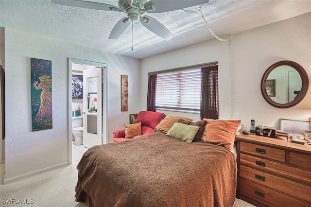 5554 Hamlet Ln, Fort Myers, FL 33919 - bedroom with light colored carpet, ensuite bathroom, and ceiling fan