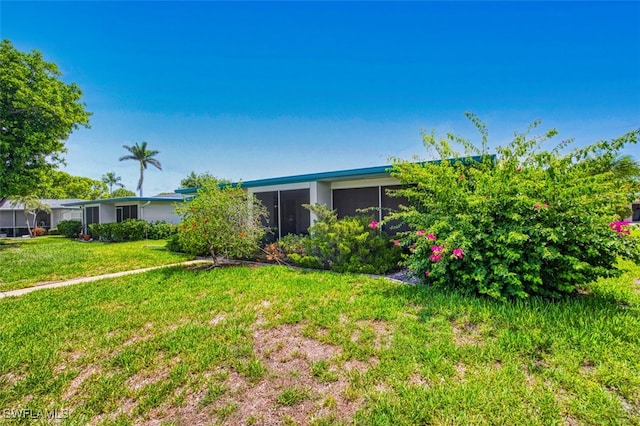5554 Hamlet Ln, Fort Myers, FL 33919 - view of front of house with a front lawn
