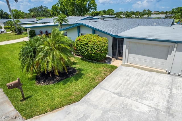 5554 Hamlet Ln, Fort Myers, FL 33919 - ranch-style house featuring an attached garage, driveway, a front lawn, and stucco siding