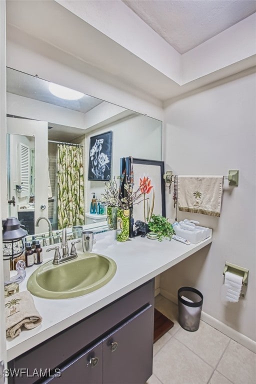 5554 Hamlet Ln, Fort Myers, FL 33919 - full bath with a raised ceiling, tile patterned floors, vanity, and curtained shower