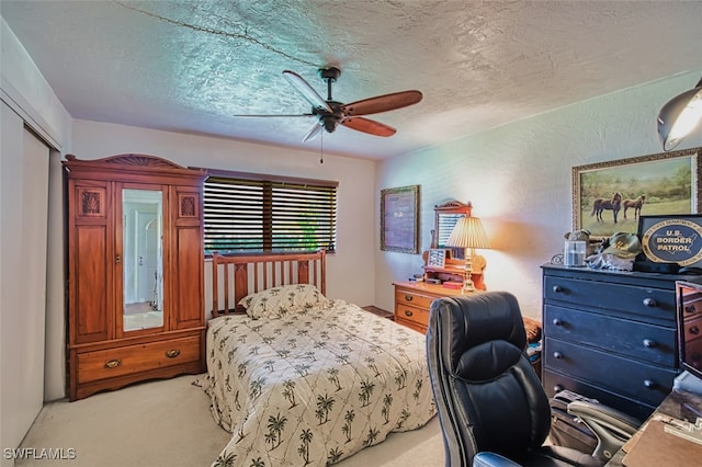 5554 Hamlet Ln, Fort Myers, FL 33919 - bedroom featuring a textured ceiling, light colored carpet, a ceiling fan, and a desk