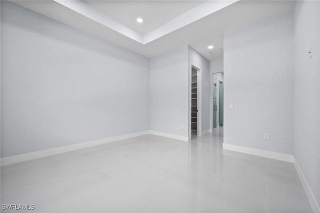 3990 27th Ave NE, Naples, FL 34120 - tiled empty room featuring recessed lighting and baseboards