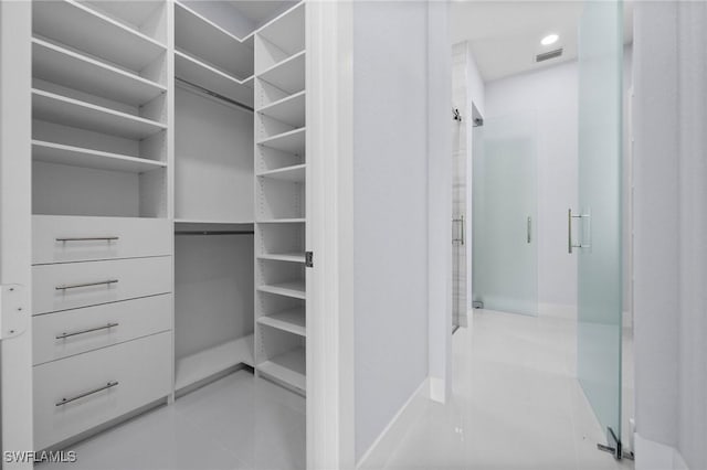 3990 27th Ave NE, Naples, FL 34120 - spacious closet with tile patterned flooring