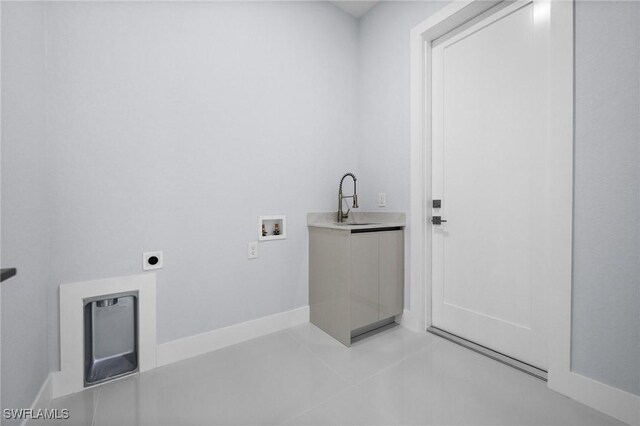 3990 27th Ave NE, Naples, FL 34120 - washroom with hookup for an electric dryer, washer hookup, and light tile patterned flooring