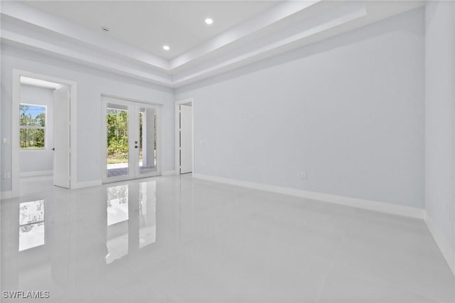 3990 27th Ave NE, Naples, FL 34120 - unfurnished room with recessed lighting, french doors, and a raised ceiling