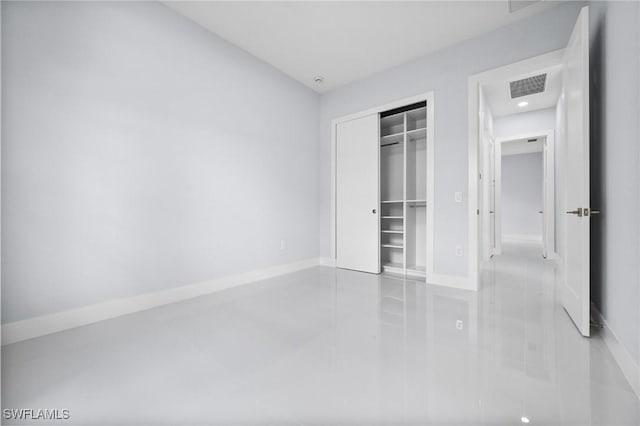 3990 27th Ave NE, Naples, FL 34120 - unfurnished bedroom with a closet and tile patterned flooring