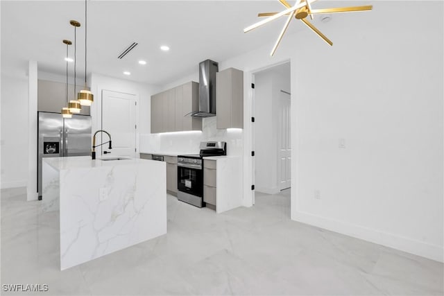 1018 Calvin Ave, Lehigh Acres, FL 33972 - kitchen featuring stainless steel appliances, wall chimney range hood, modern cabinets, recessed lighting, and decorative light fixtures