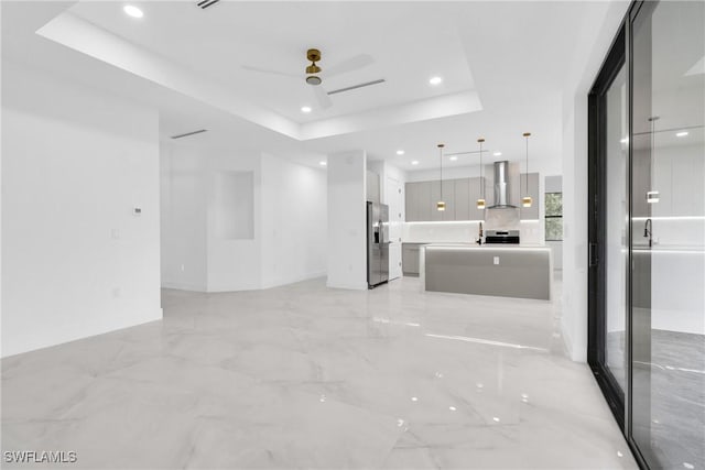 1018 Calvin Ave, Lehigh Acres, FL 33972 - spare room with a raised ceiling, a ceiling fan, recessed lighting, and light marble finish floors