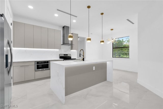 1018 Calvin Ave, Lehigh Acres, FL 33972 - kitchen with wall chimney exhaust hood, gray cabinets, modern cabinets, appliances with stainless steel finishes, and light marble finish floors