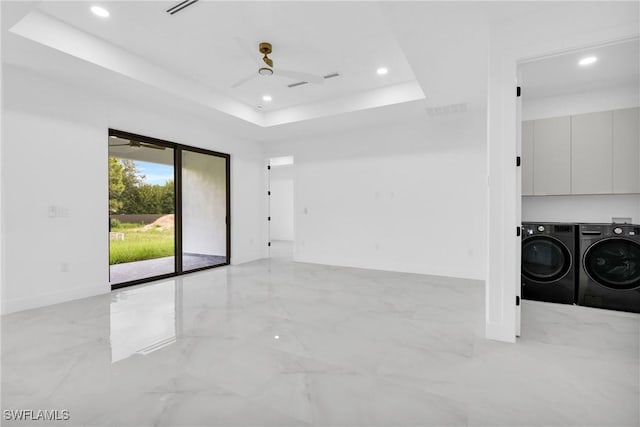 1018 Calvin Ave, Lehigh Acres, FL 33972 - spare room featuring washer and clothes dryer, ceiling fan, light marble finish floors, a raised ceiling, and recessed lighting