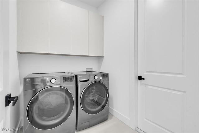 1018 Calvin Ave, Lehigh Acres, FL 33972 - washroom featuring washing machine and clothes dryer and cabinet space