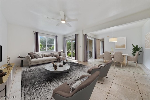 2810 Citrus Lake Dr Unit U101, Naples, FL 34109 - living room with light tile patterned flooring and a ceiling fan