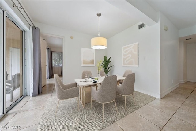 2810 Citrus Lake Dr Unit U101, Naples, FL 34109 - dining room featuring light tile patterned floors and baseboards