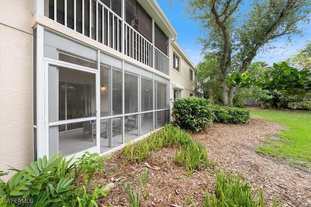 2810 Citrus Lake Dr Unit U101, Naples, FL 34109 - view of side of property featuring stucco siding and a sunroom