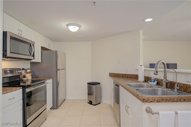 1763 Four Mile Cove Pkwy Unit 611, Cape Coral, FL 33990 - kitchen with stainless steel appliances, white cabinets, light tile patterned floors, a peninsula, and recessed lighting
