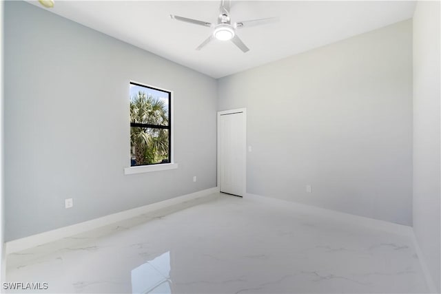 4002 22nd St SW, Lehigh Acres, FL 33976 - unfurnished room with light marble finish flooring and ceiling fan