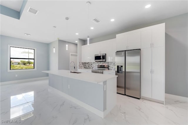 4002 22nd St SW, Lehigh Acres, FL 33976 - kitchen featuring stainless steel appliances, light marble finish floors, recessed lighting, backsplash, and light countertops