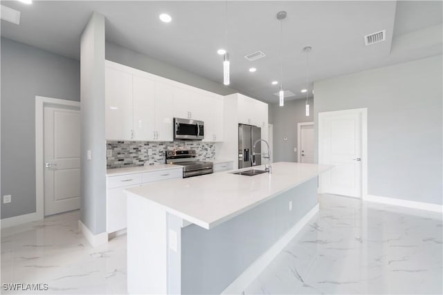 4002 22nd St SW, Lehigh Acres, FL 33976 - kitchen featuring stainless steel appliances, light marble finish flooring, a spacious island, white cabinetry, and recessed lighting