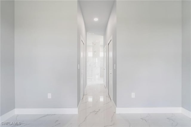 4002 22nd St SW, Lehigh Acres, FL 33976 - hallway with light marble finish flooring and recessed lighting