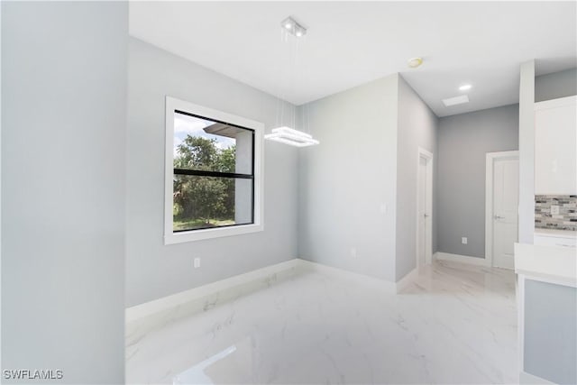 4002 22nd St SW, Lehigh Acres, FL 33976 - empty room with light marble finish flooring and baseboards