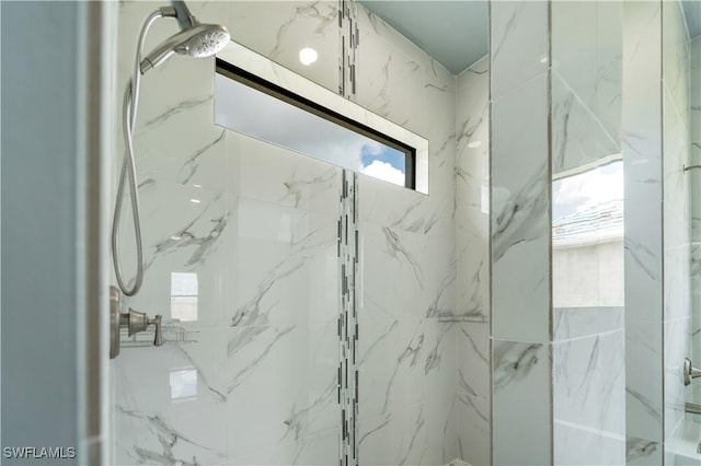 4002 22nd St SW, Lehigh Acres, FL 33976 - bathroom with a marble finish shower and healthy amount of natural light